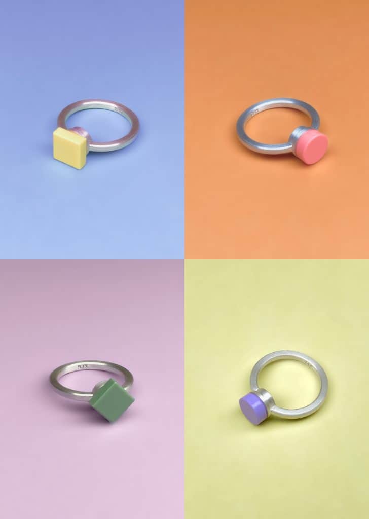 Studio GOGO modular rings in bright colors, photographed on pastel backgrounds, showcasing playful and customizable designs.