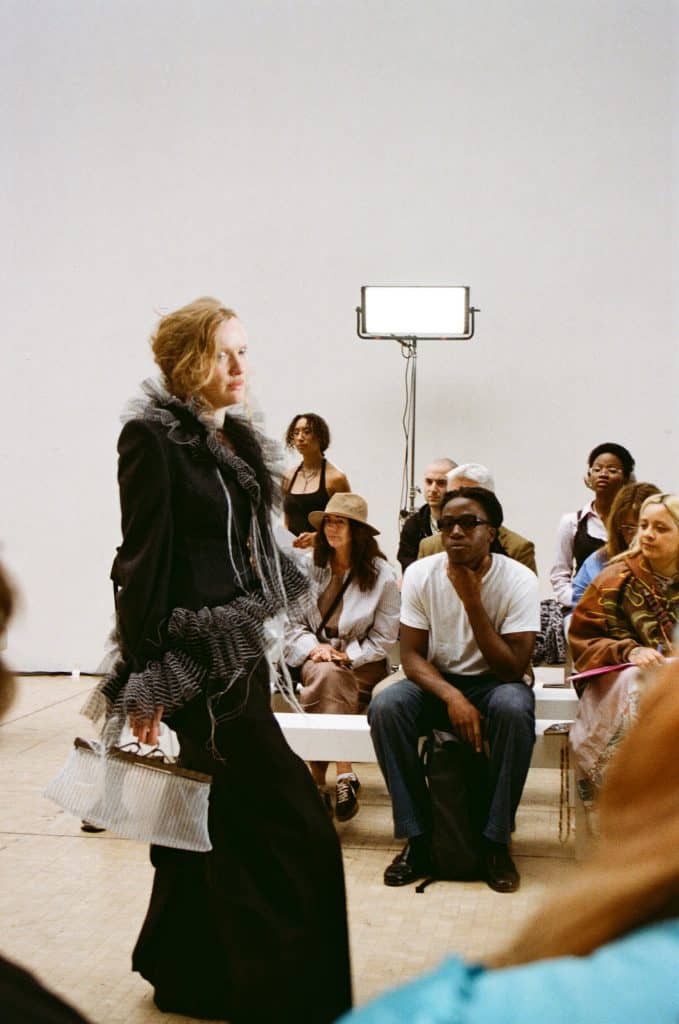 Two models wear Hannah Smith’s inclusive collection during the Central Saint Martins runway show, blending structure and softness.