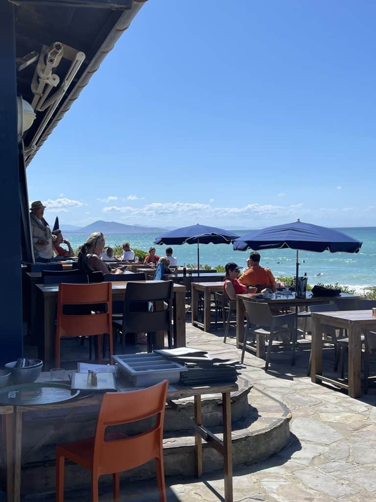 Outdoor terrace in Biarritz with ocean view and sun umbrellas