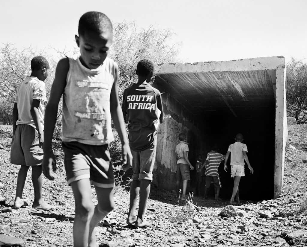 Boys in a gallery, Pomfret Asbestos Mine Boys at the shaft, Pomfret Asbestos Mine, 2013 from the series The Borderlands silver gelatin print by Jo Ractliffe