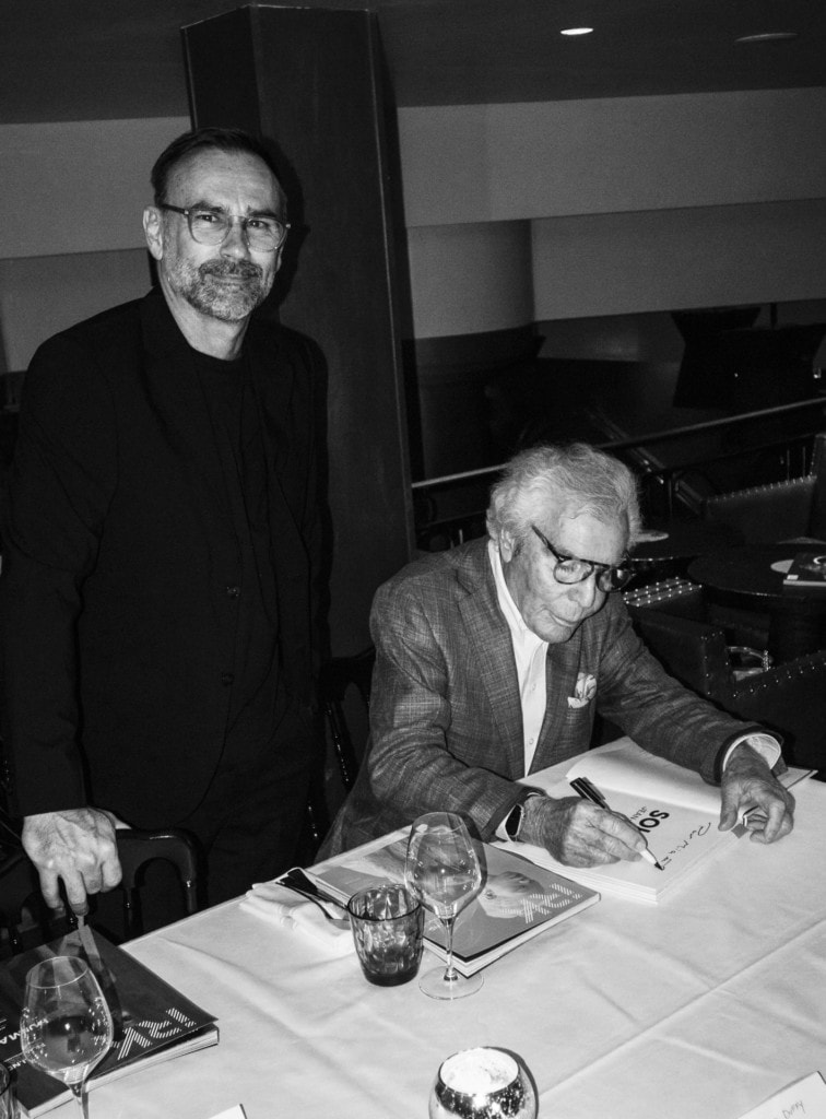 Jean Daniel Lorieux, the evening's gracious host signing a copy of his book for Julien Crouigneau