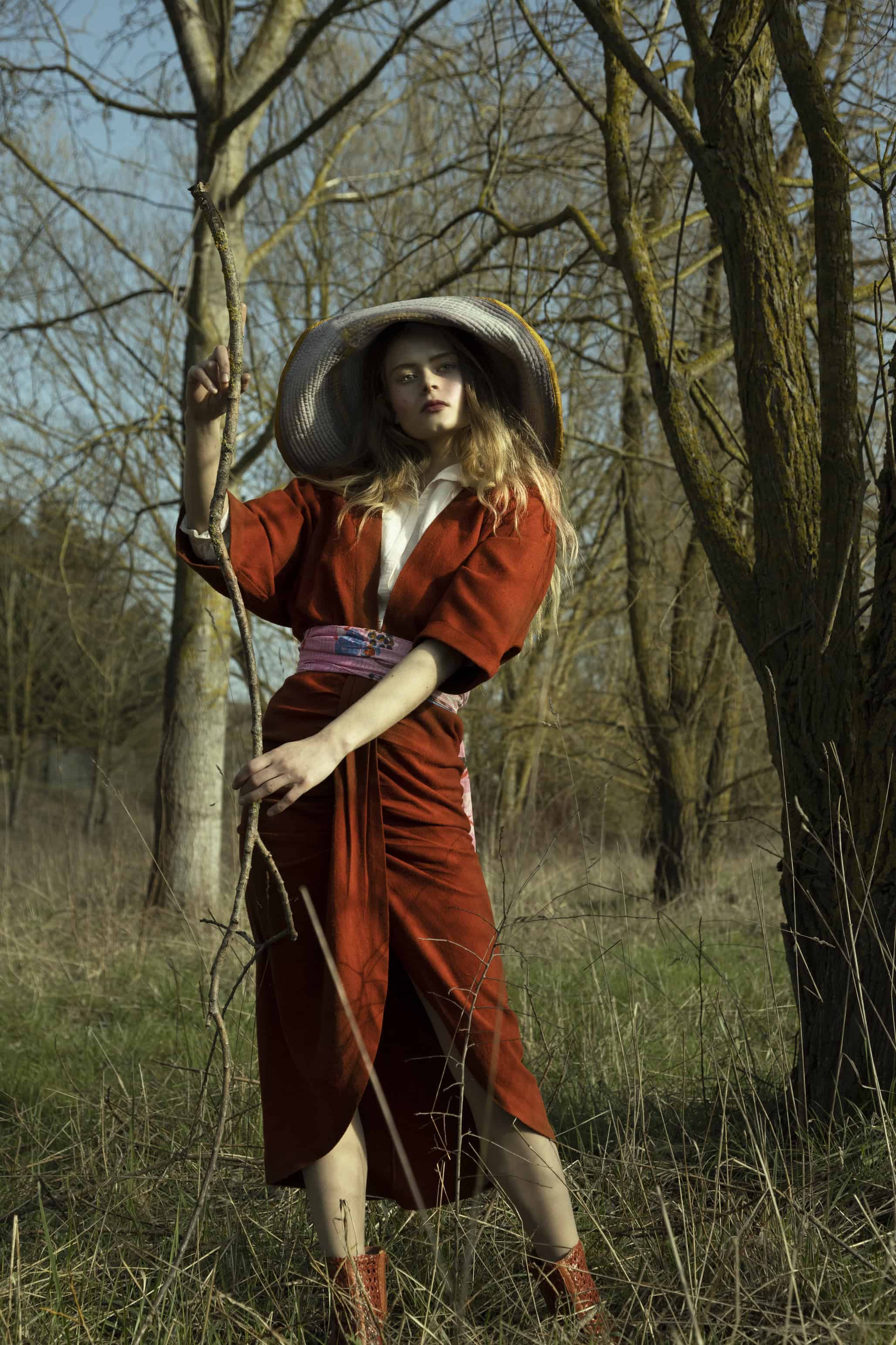 French girl in red dress in nature in Burgundy dress Valentine Gauthier, blouse Sessùn, shawl as belt Epice, boots Sarenza, hat Romualda.