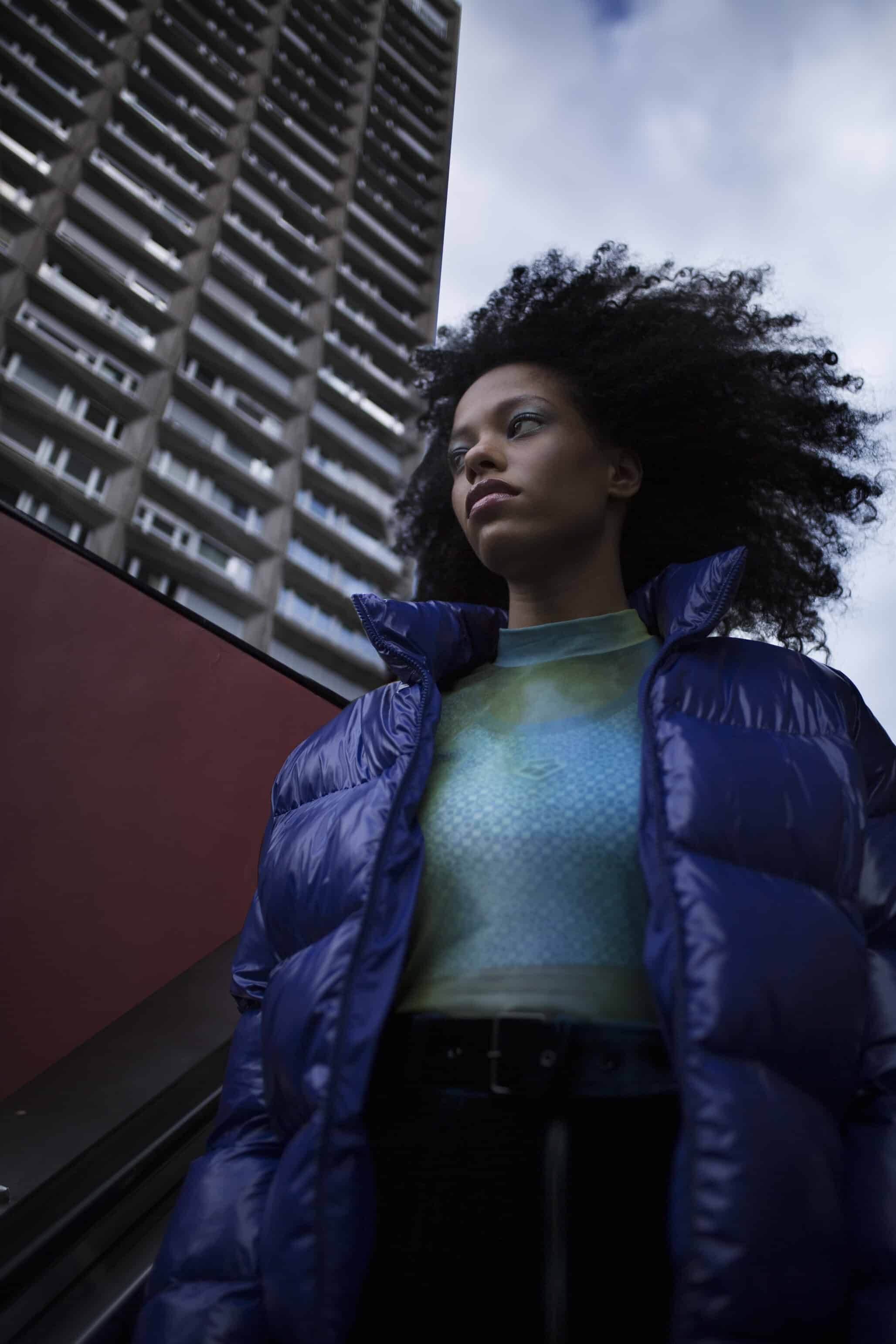 Purple puffy jacket NAPAPIJRI, ocean blue velvet skirt MOLLY BRACKEN, jellyfish body suit WOLFORD, logo print sports bra ARENA.