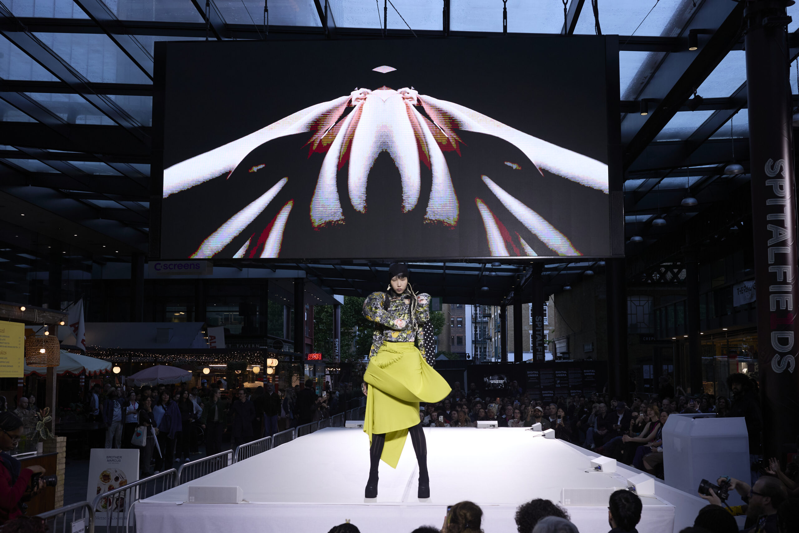 Alt: "Models present collections by emerging designers during the Fashion District Showcase 2026 in London, United Kingdom. The showcase featured work by Barbara Hornok"
