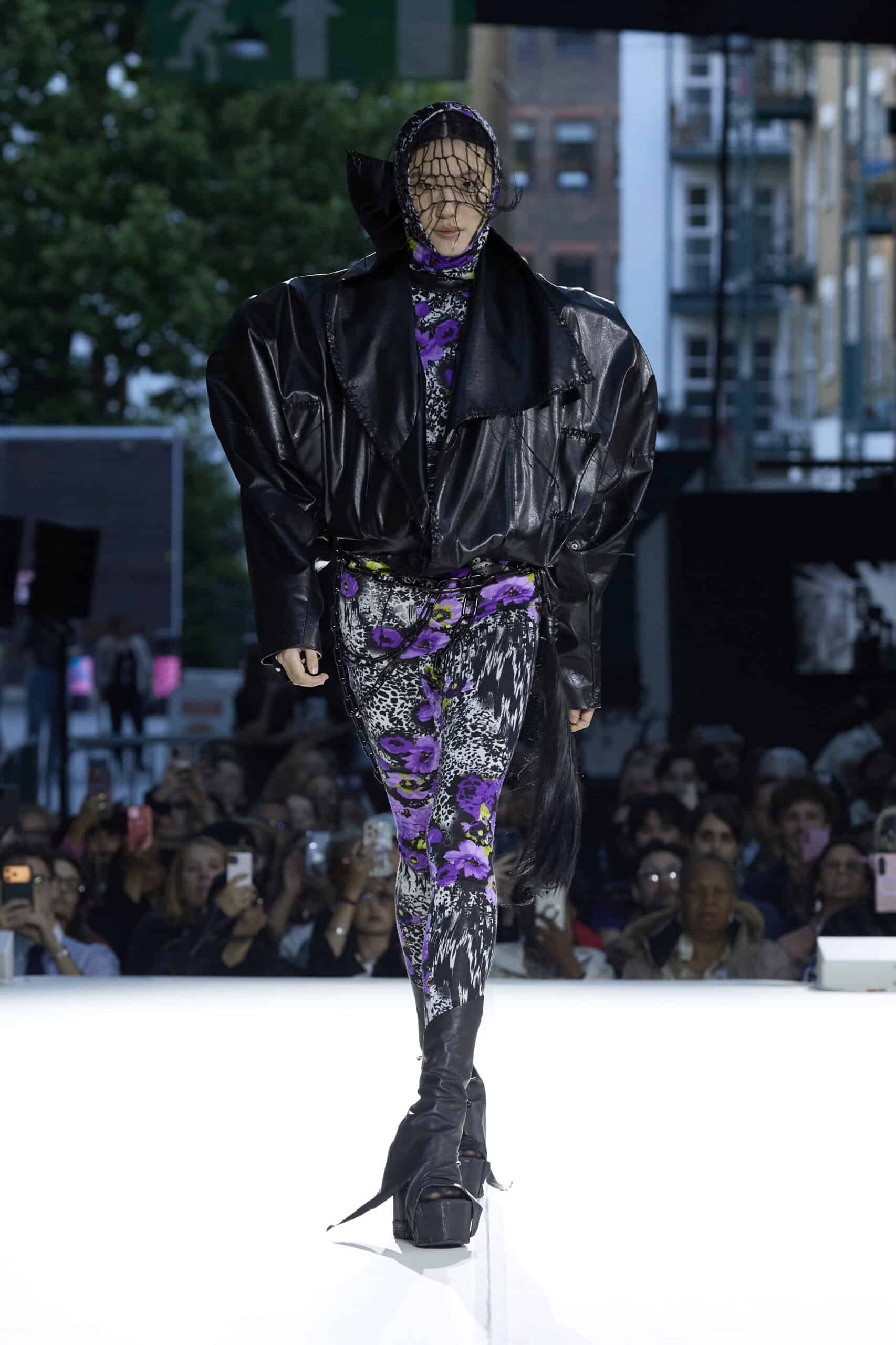 Alt: "Models present collections by emerging designers during the Fashion District Showcase 2026 in London, United Kingdom. The showcase featured work by Barbara Hornok"