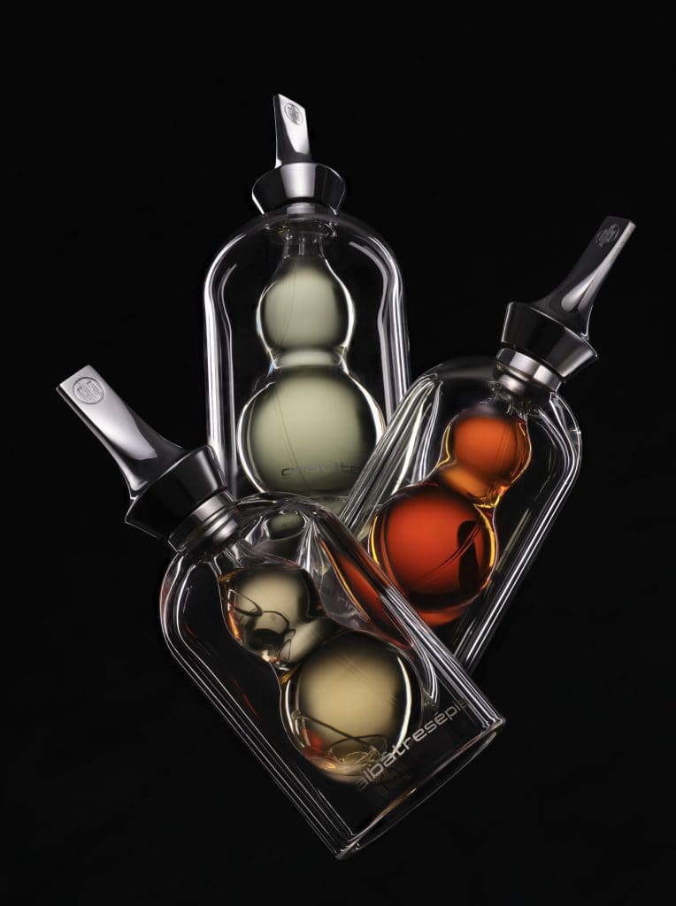Artistic fragrance bottles by Première Peau with layered colors symbolizing creativity and imperfection.