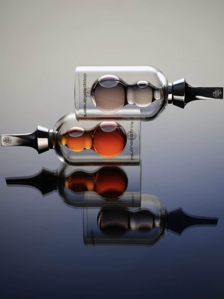Avant-garde perfume creations by Première Peau displayed in sculptural glass vials, reflecting experimental haute perfumery.
