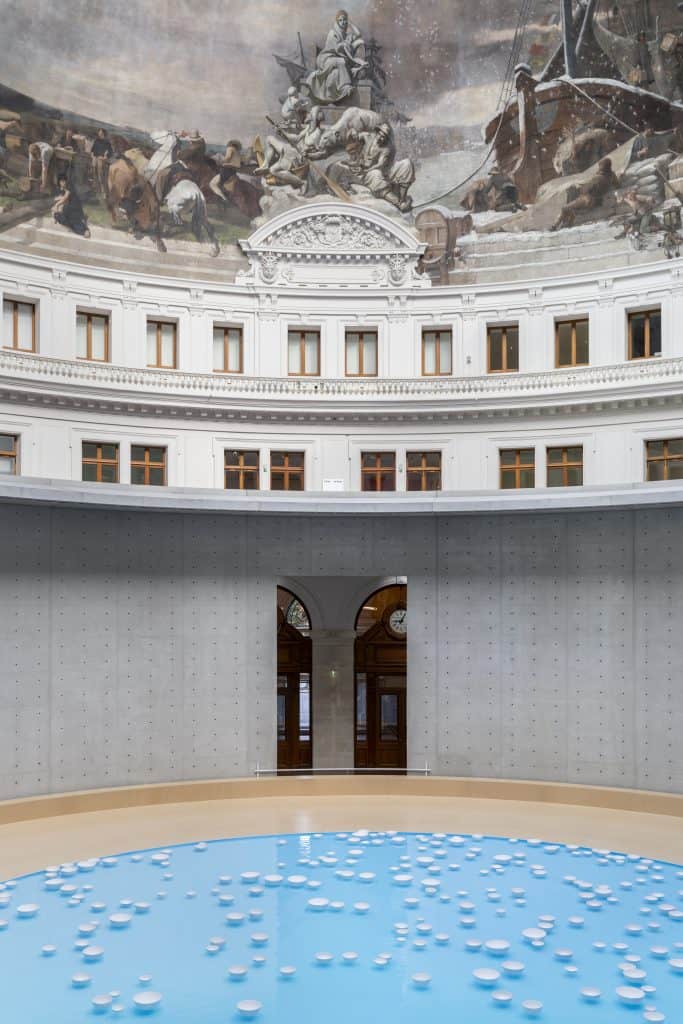 Installation view of Céleste Boursier-Mougenot’s porcelain bowl symphony at the Bourse de Commerce beneath the frescoed dome.