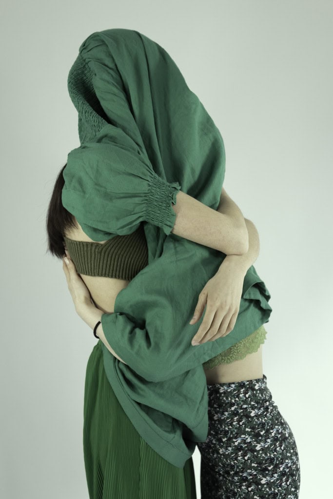 Circularity image with 2 women draped in green clothing