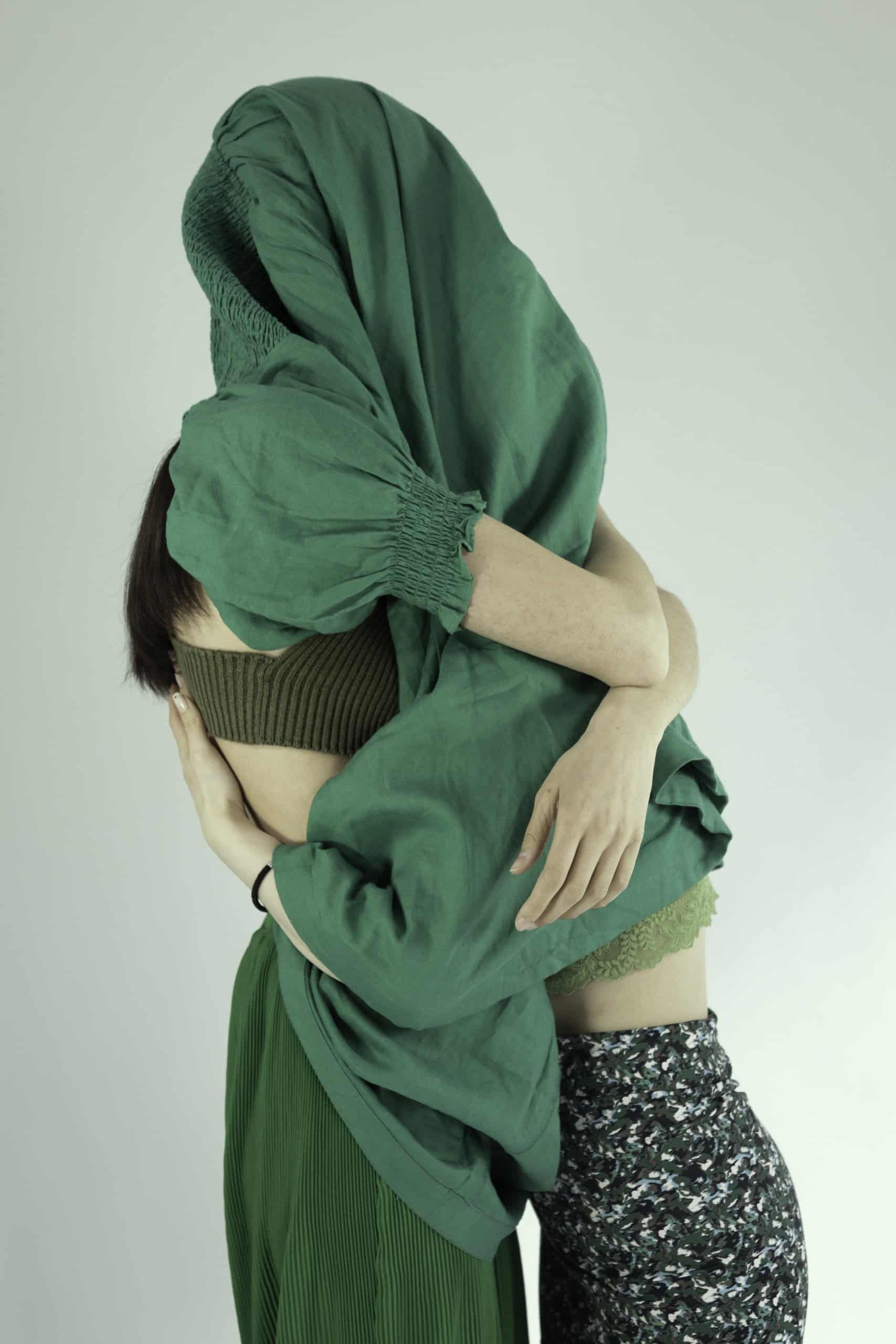 Circularity image with 2 women draped in green clothing