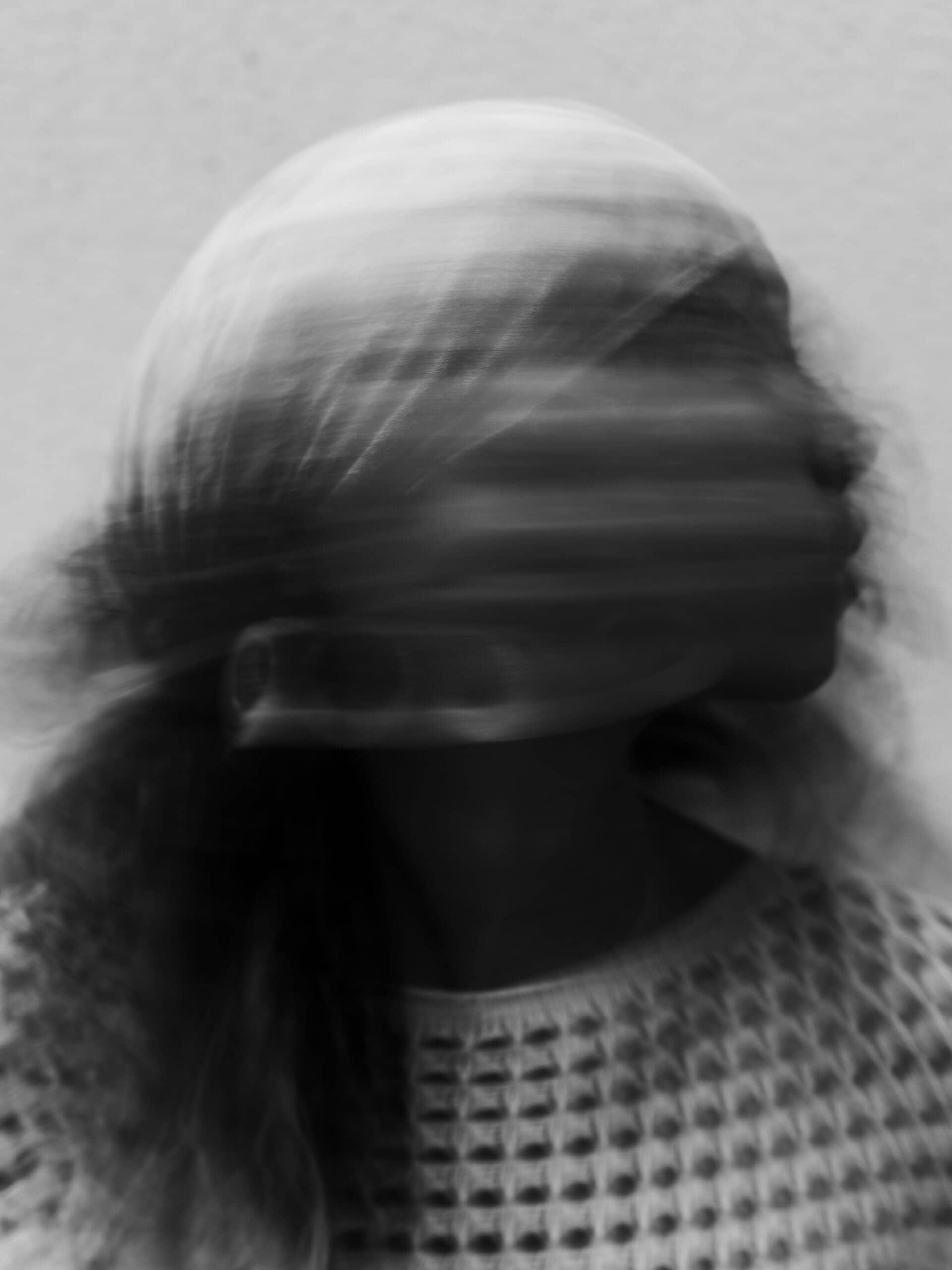 This blurred portrait echoes the tension explored in Undressed to Impress, how pressure to fit a visual, mold can erase the very person behind it. Model : Victoria Lenglare, Photographer: maximgenay For undressed to impress 