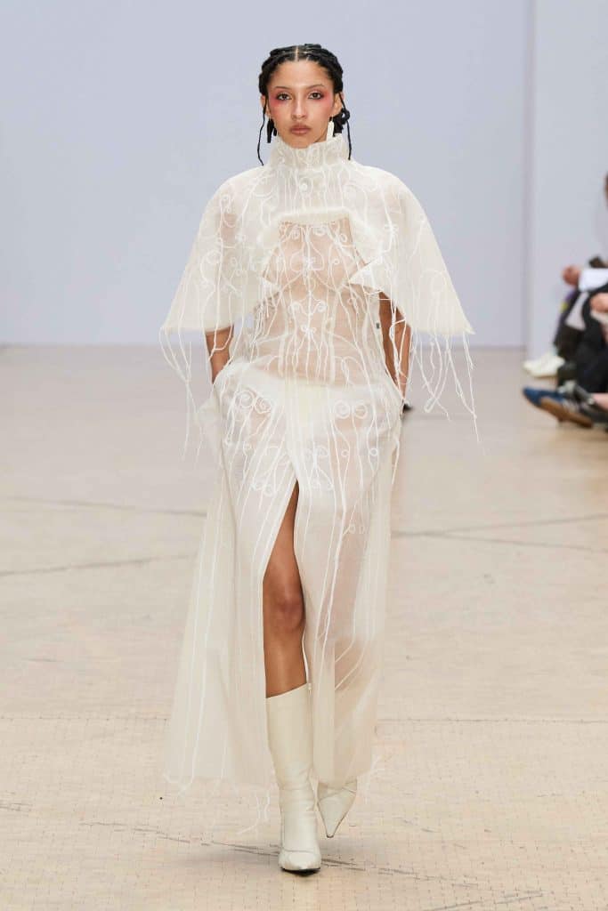 A model in a wheelchair wears a voluminous mesh skirt designed during Graduate Fashion Week.