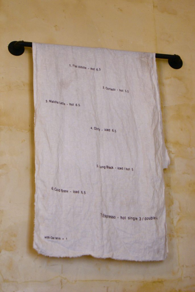 Wall textile with minimalist embroidery, Sevenly Heart Paris interior.