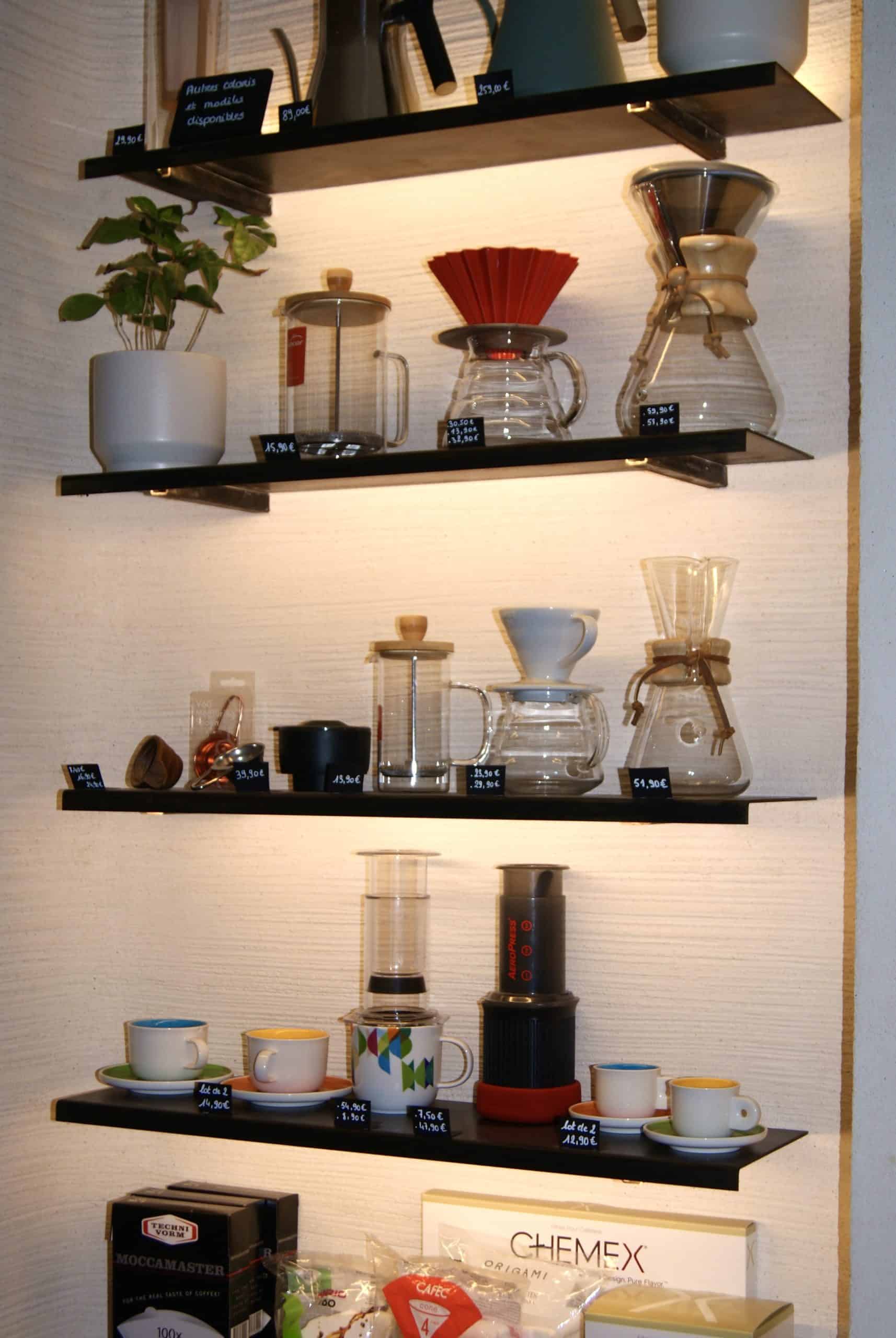 Coffee brewing equipment and design objects inside Araku Coffee Paris.
