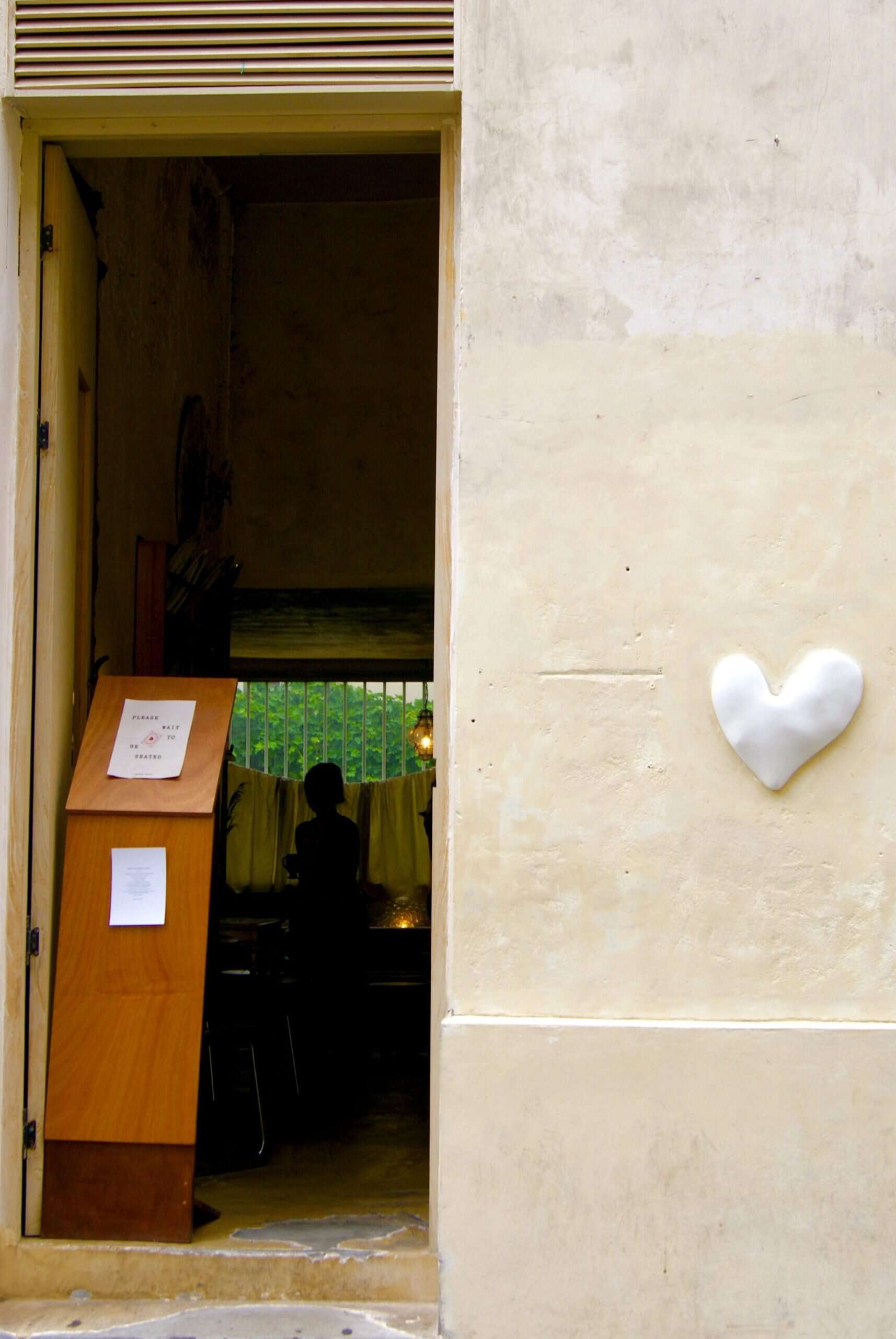 Coffee shop entrance with heart-shaped detail, Sevenly Heart Paris.