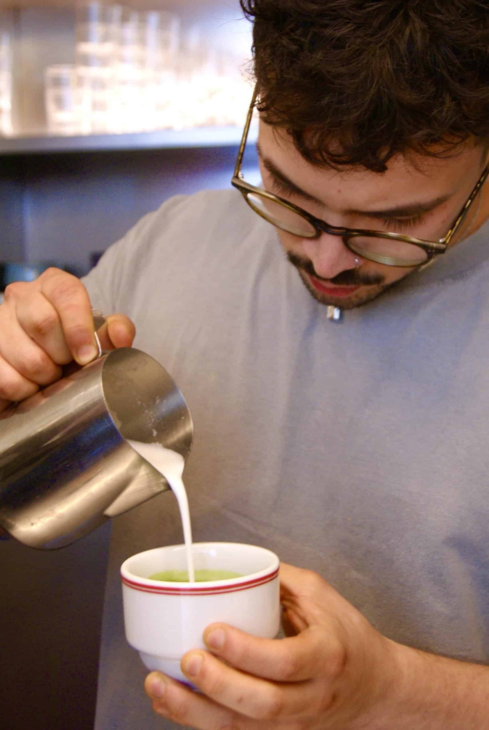  barista pouring milk