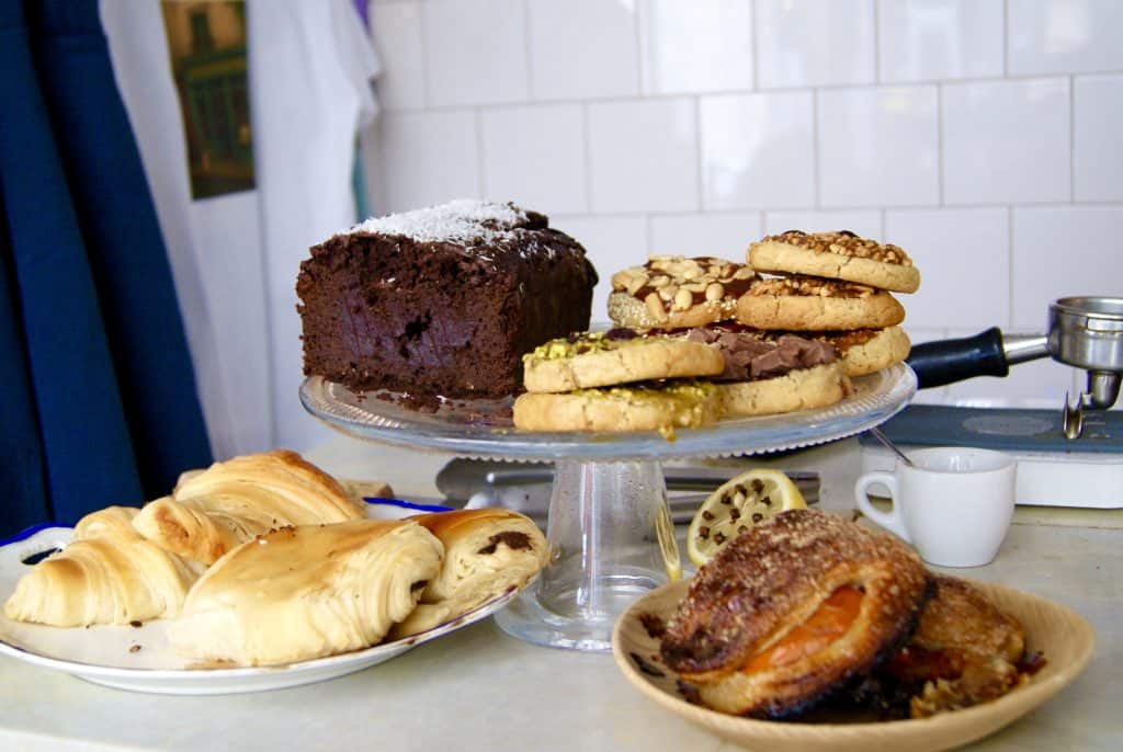 Coffee shop pastries displayed on a marble counter at Boot Café Paris.