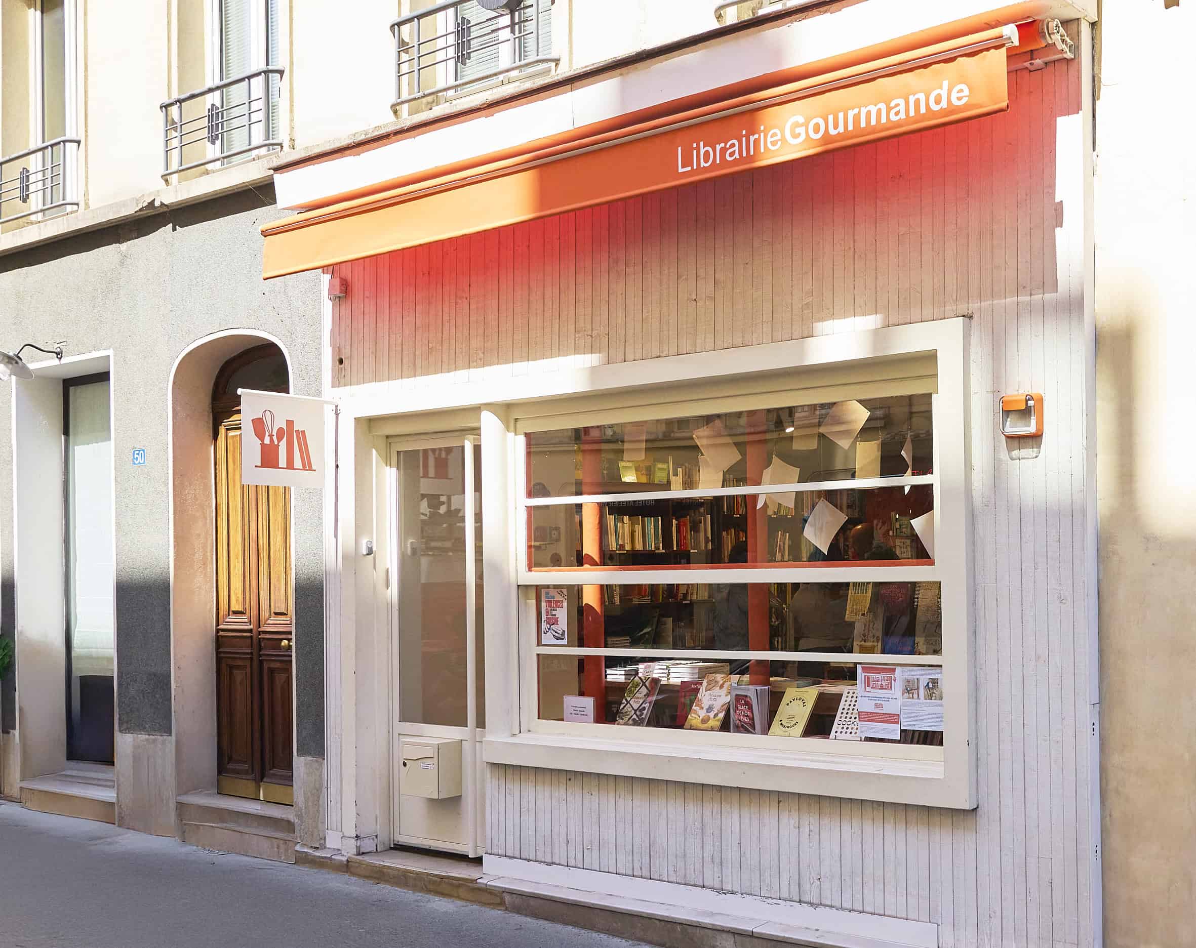 Front view of La Librairie Gourmande in Paris, a specialized bookstore dedicated to cookbooks and culinary literature, photographed by Delphine Constantini.