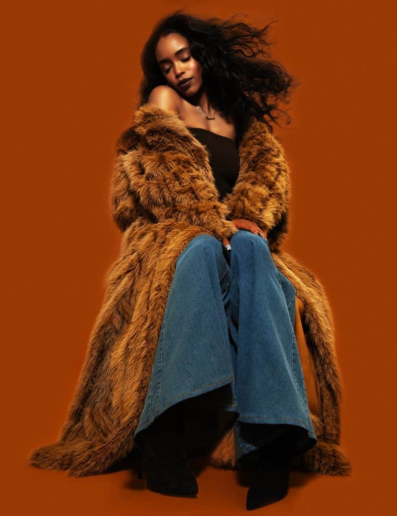 African American actress dressed in big fur
