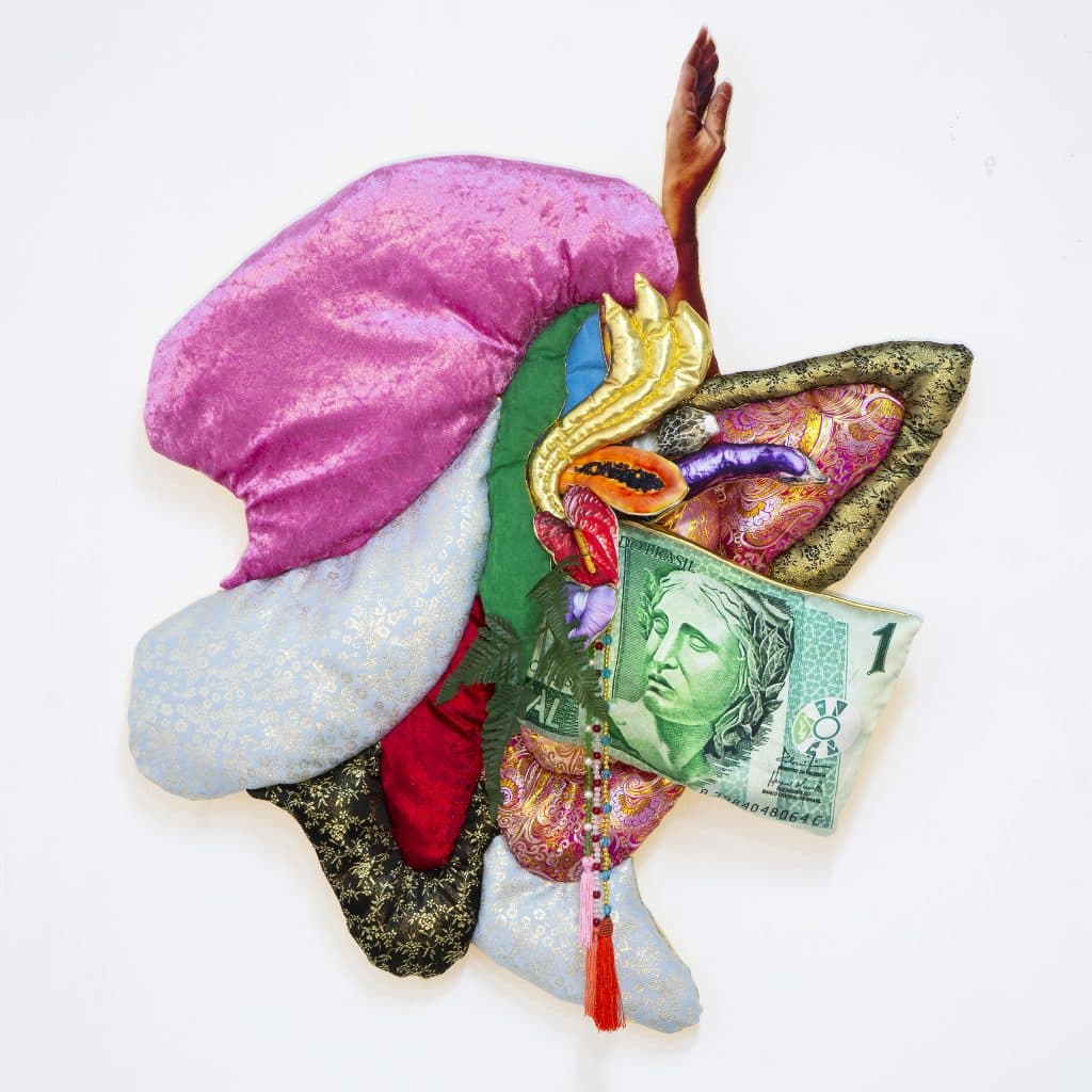 Textile-based artwork combining photography, pearls, and floral fabrics in layered sculptural form. ENTRE TRÓPICOS