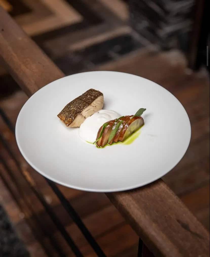 White fish, nordic creme and root vegetable on a plate. Best Restaurant in Mexico City