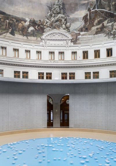 Installation view of Céleste Boursier-Mougenot’s porcelain bowl symphony at the Bourse de Commerce beneath the frescoed dome.