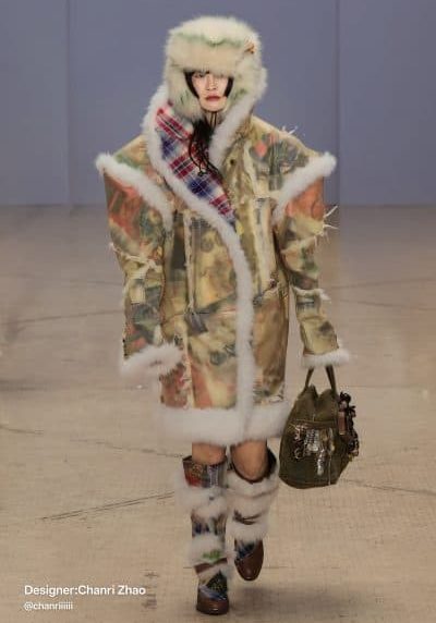 Model wears a translucent shearling-lined coat with layered prints, tartan details, and matching fur boots—designed by Chanri Zhao at Central Saint Martins.
