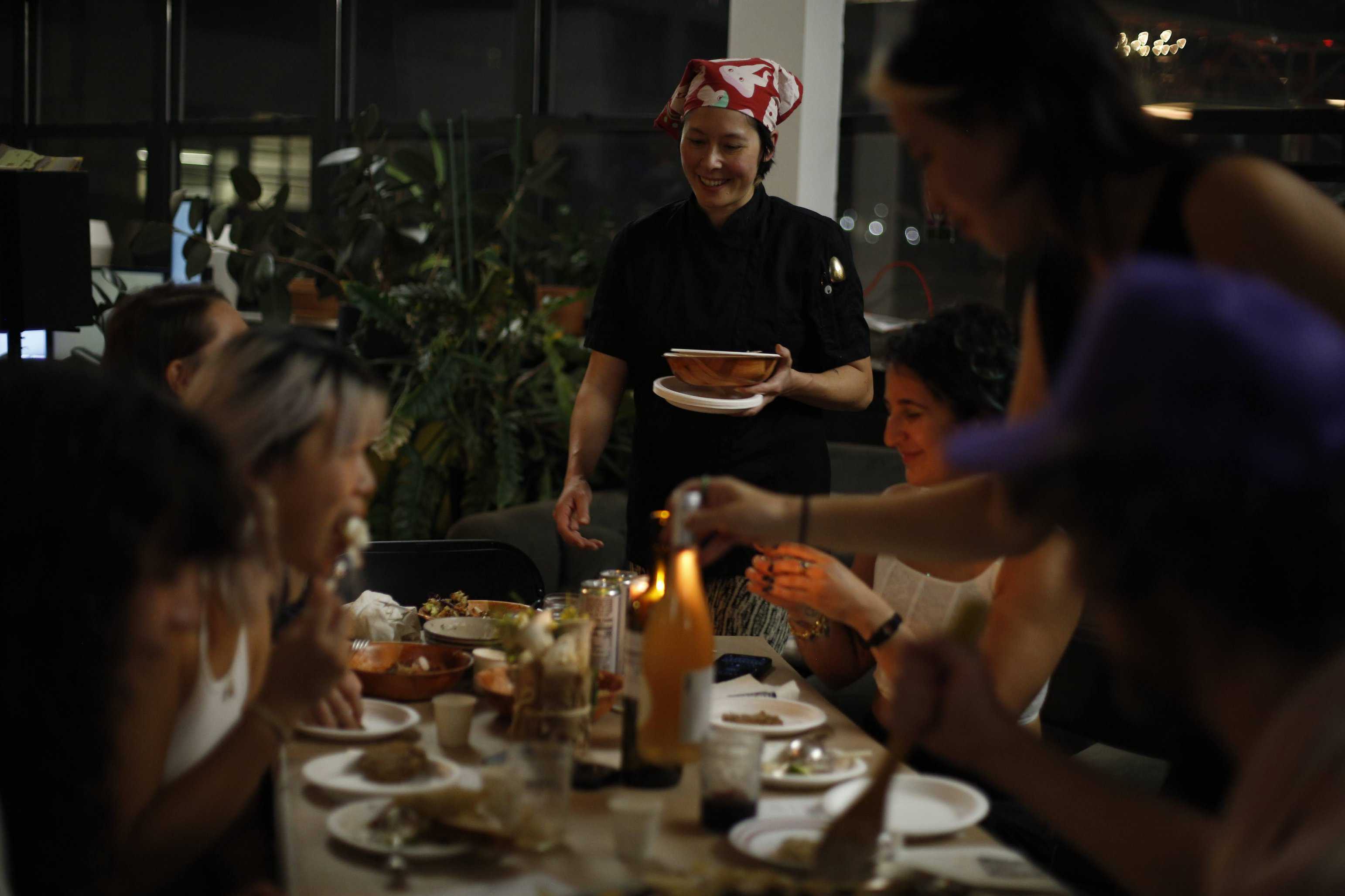 Guests being served mushrooms at the dinner table How to Trip with friends