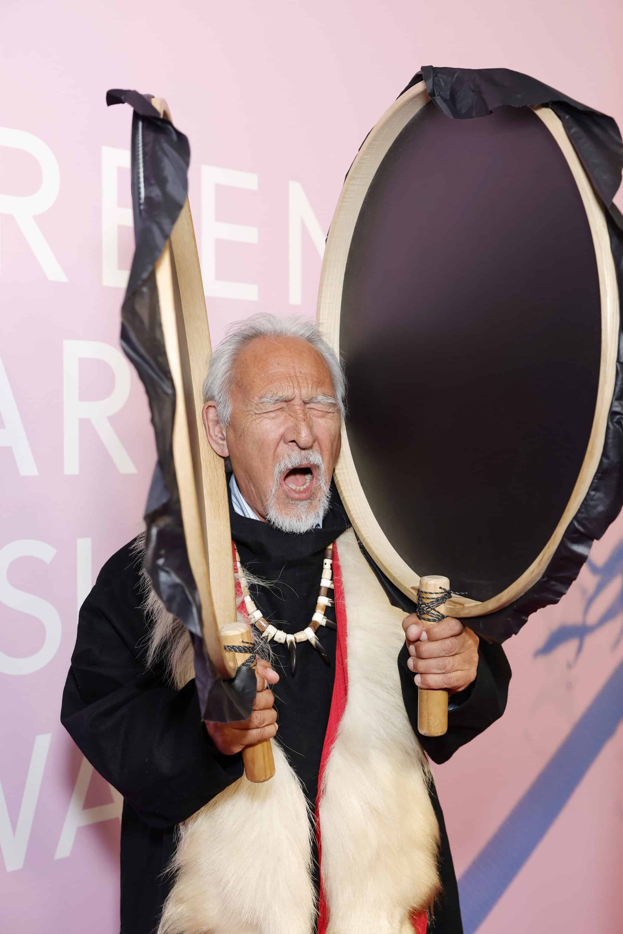 Angaangaq Angakkorsuaq on red carpet at Green Carpet Fashion Awards, fashion photography