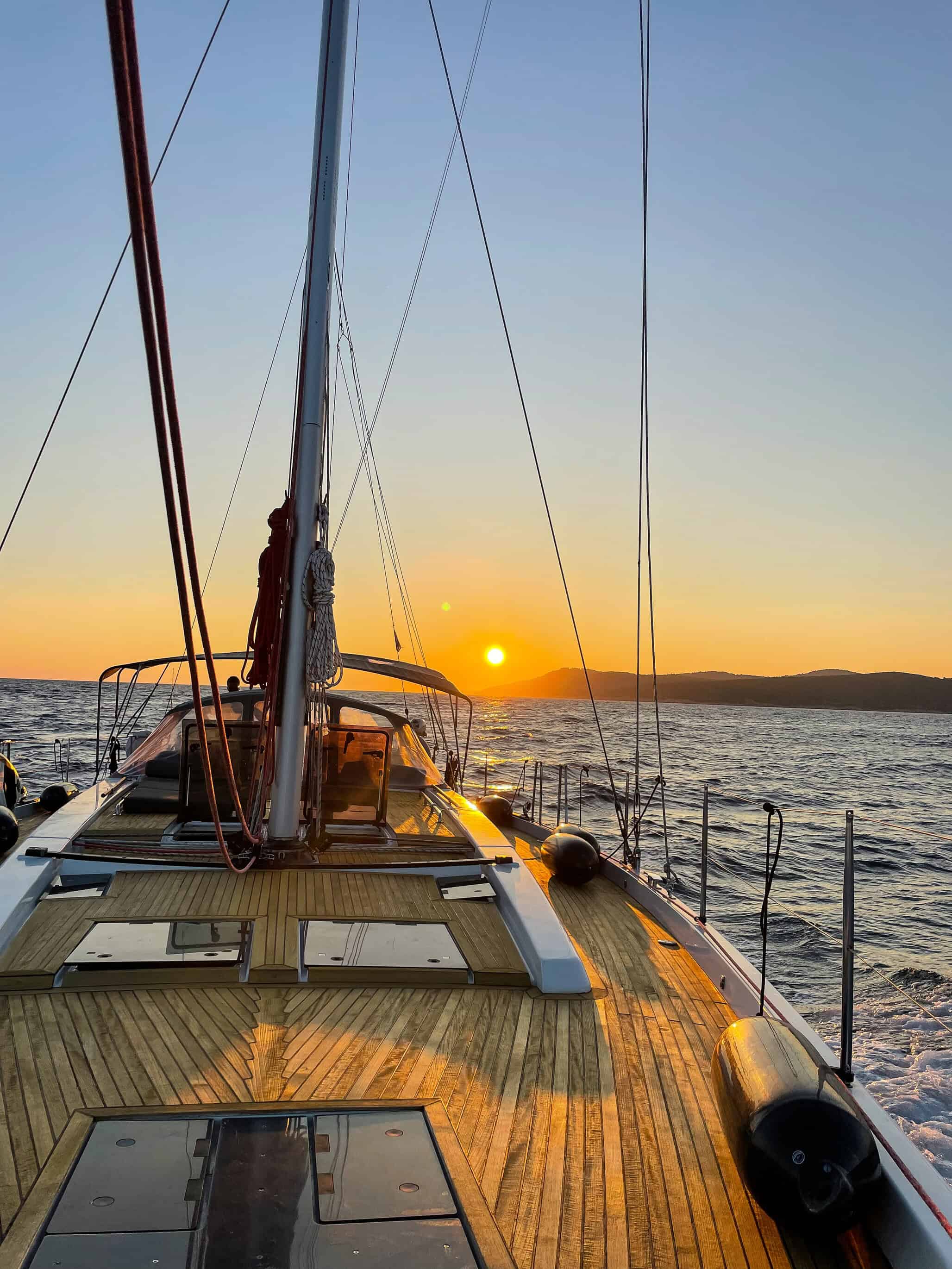color landscape photograph of ship deck at sunset