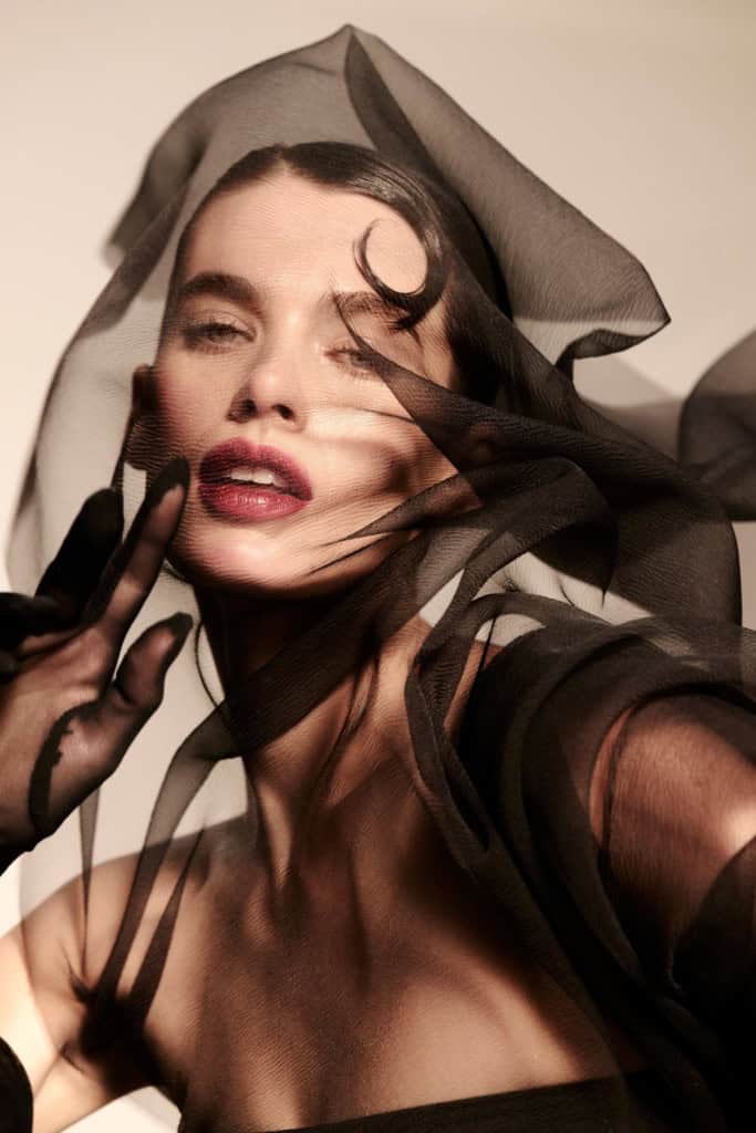 Model Keltie Straith embodies the essence of the film's female lead, exuding a blend of seductive confidence and lethal elegance