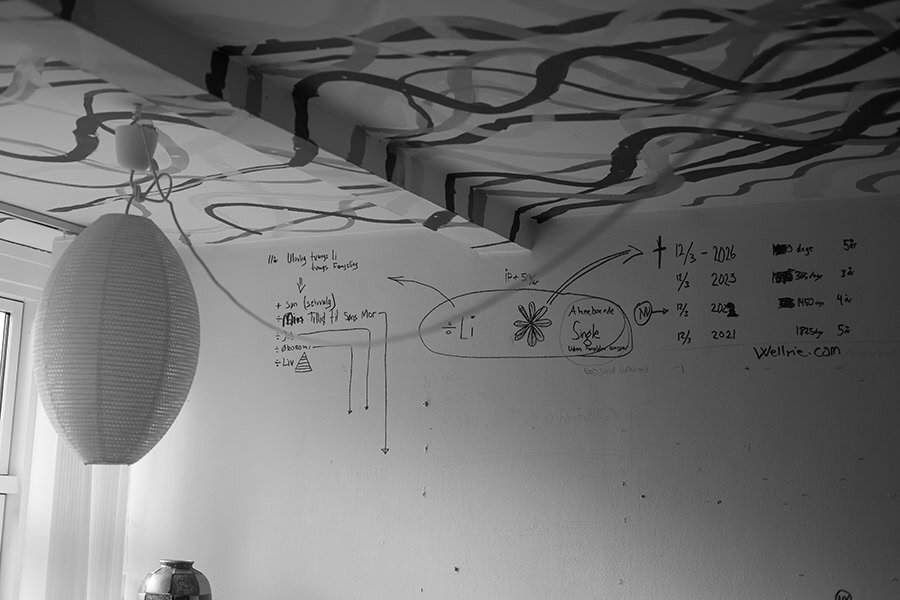 Photograph of ceiling with hand drawn symbols and lines