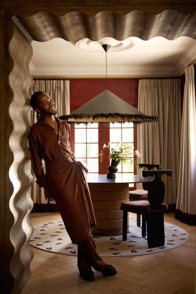 Thebe Magugu against the sculpted archway 