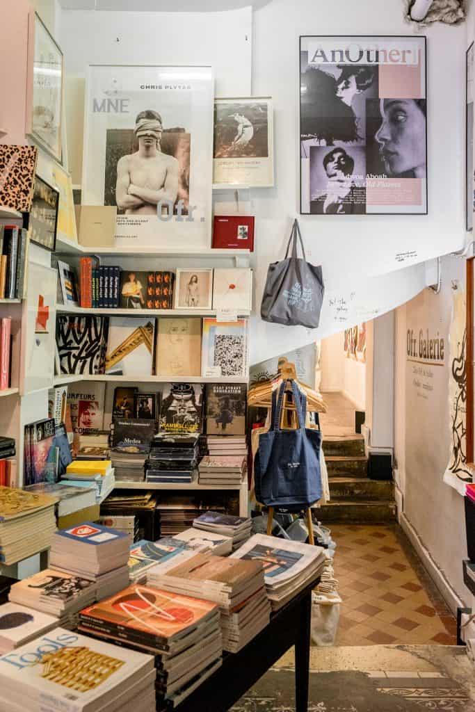 Interior view of OFR., Full of books, pictures, and even tote bags. 