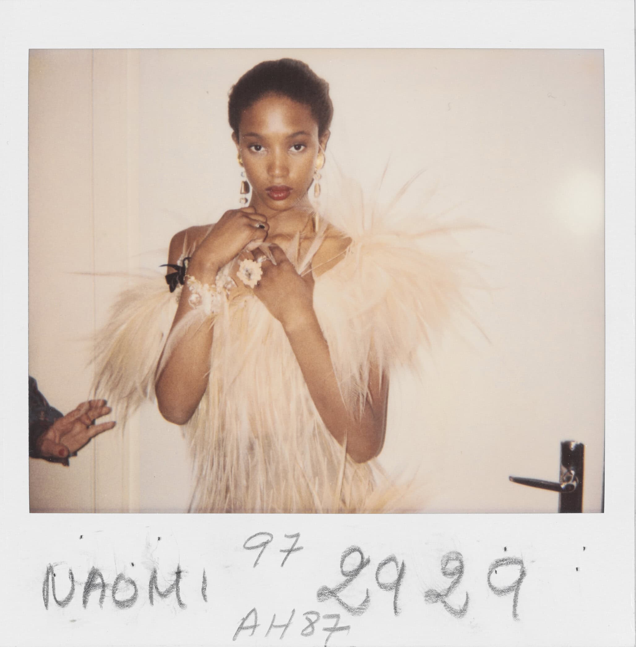 Polaroid taken by the staff of the couture house, fitting rooms at 5 Avenue Marceau, Paris. Evening gown worn by Naomi Campbell, haute couture fall-winter 1987 collection, July 1987.
Photo credit: © Yves Saint Laurent © Fondation Pierre Bergé – Yves Saint Laurent